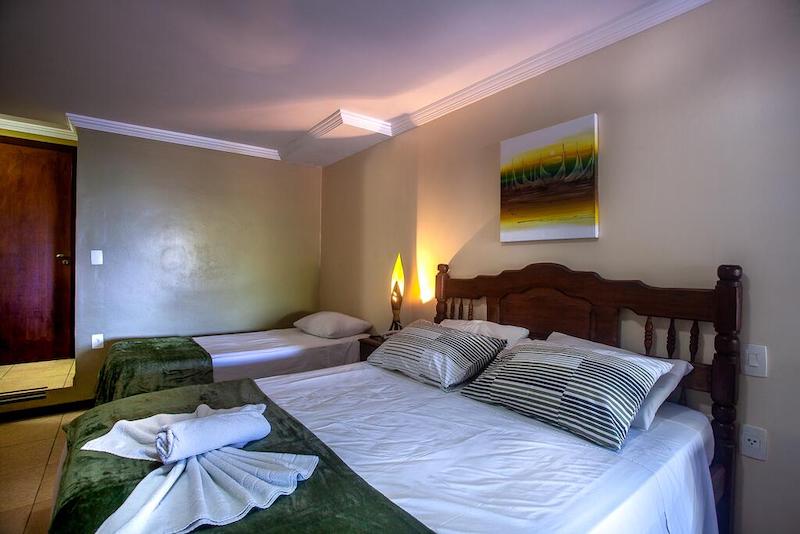 Quarto e cama no Castelo Beach Hotel em Natal